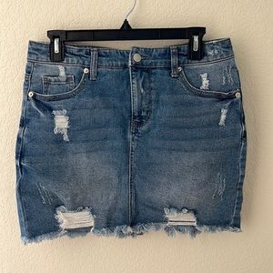 Distressed denim skirt, like new only worn 1-2 times. No stretch to it.